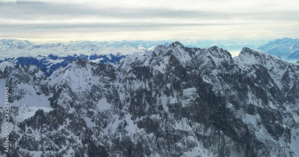 close flight to rocky mountains covered with snow close flight to rocky mountains covered with snow