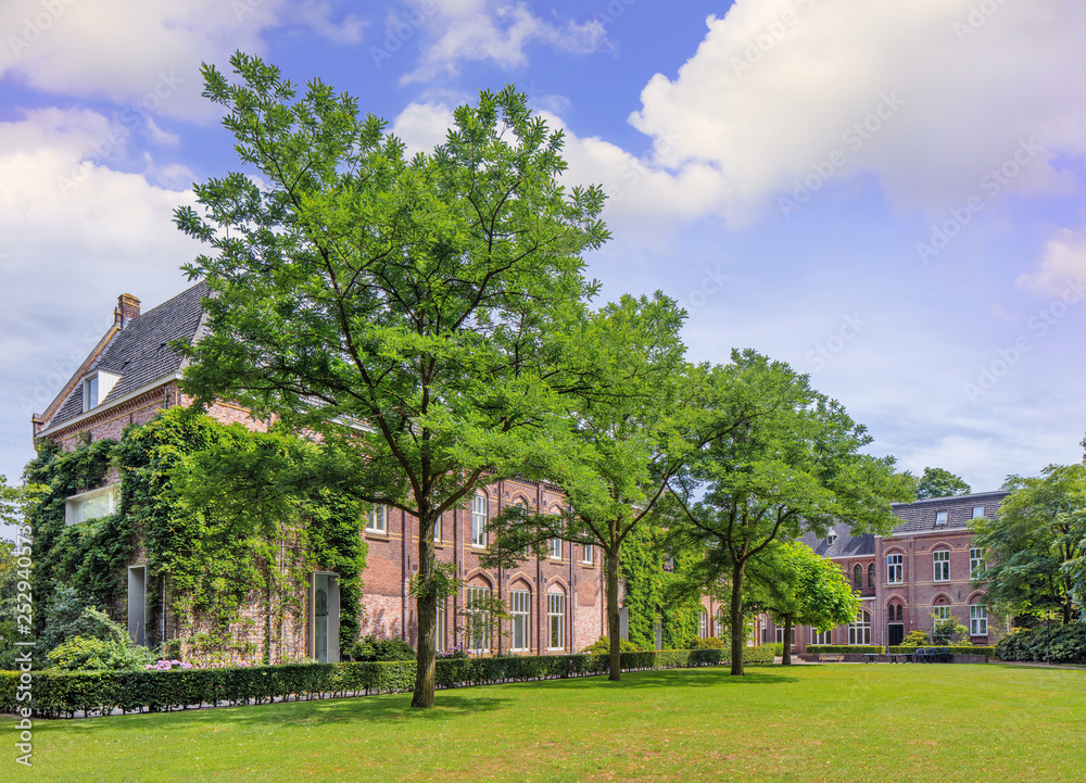 Renovated brick monastery in a lush green environment, Tilburg, Netherlands
