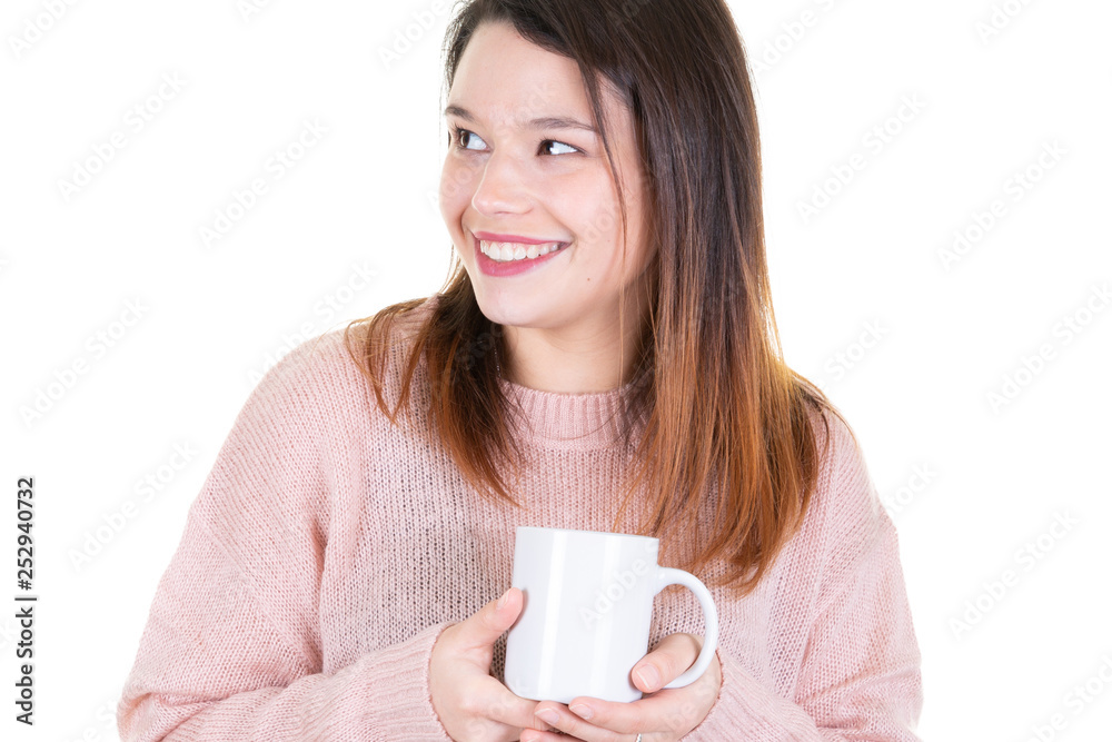 Confident smiling young woman drinking coffee and looking side blank copy space Confident smiling young woman drinking coffee and looking side blank copy space