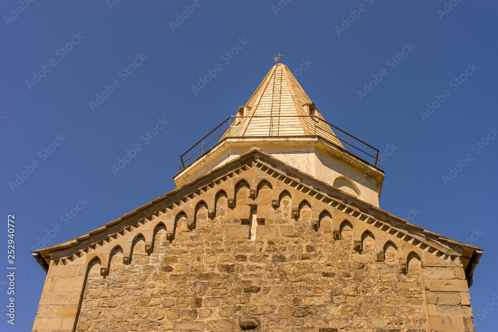 Italy, Cinque Terre, Corniglia, a large brick building church with a clock tower