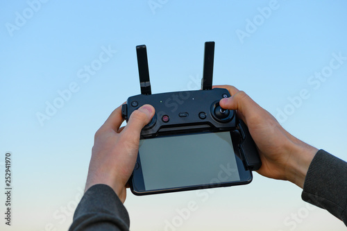 Man holds the remote control