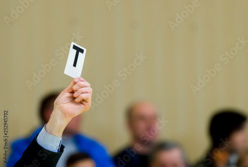 Referee shows card during table tennis match