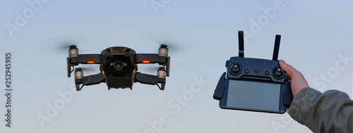 Drone in the air with operator