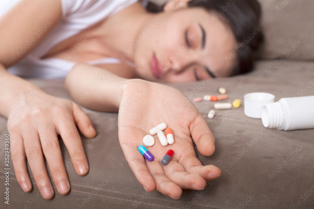 woman taking medicine tablet