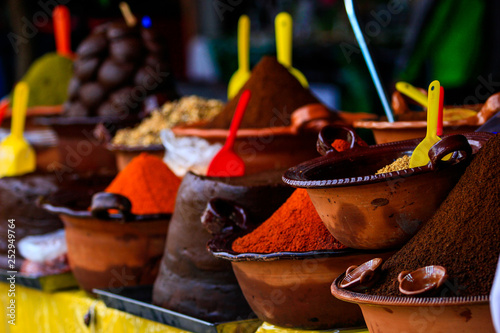 Several handmade clay pot with podwer to prepare traditional mexican dish mole
