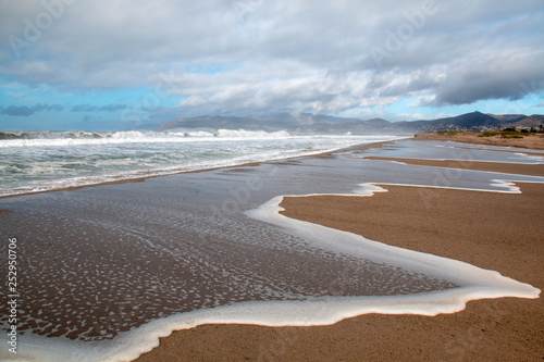 Pacific ocean wave tidal overflowing into Santa Clara river estuary at Ventura California United States photo