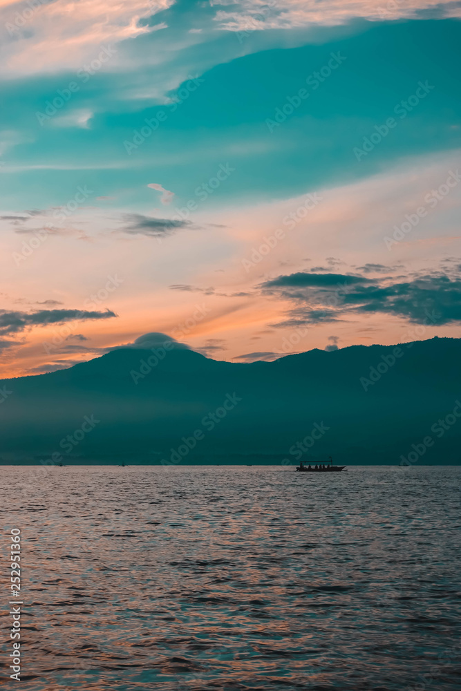 Sunrise in the ocean, Lovina, north of Bali, Indonesia