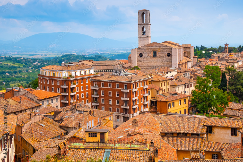 Perugia, Umbria / Italy - 2018/05/28: Panoramic view of Perugia and Umbria region mountains and hills with St. Domenico Basilica - Basilica di San Domenico