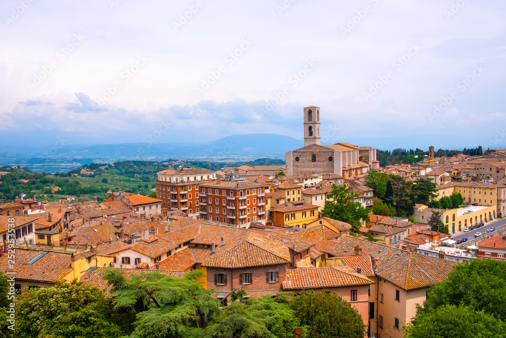 Perugia, Umbria / Italy - 2018/05/28: Panoramic view of Perugia and Umbria region mountains and hills with St. Domenico Basilica - Basilica di San Domenico