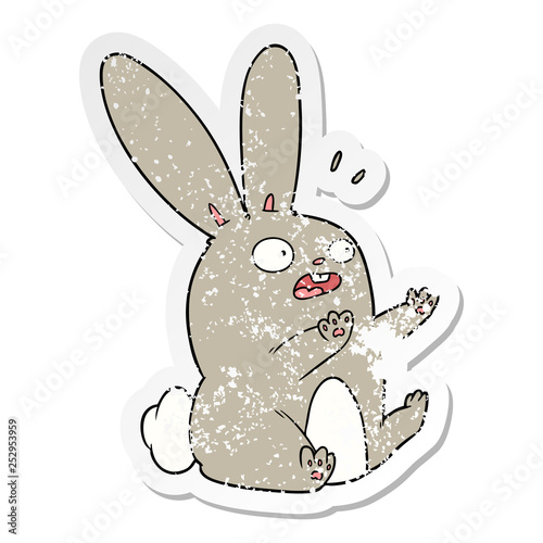 distressed sticker of a cartoon startled rabbit