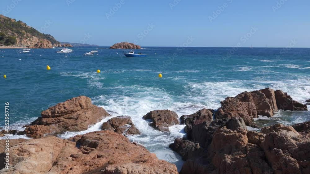 Stormy sea off the rocky coast Tossa de Mar in sunny day. Costa Brava, Catalonia, Spain Stormy sea off the rocky coast Tossa de Mar in sunny day. Costa Brava, Catalonia, Spain
