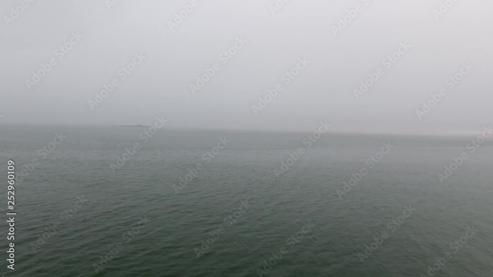 Wide still evening shot speeding across the calm waters of the Pacific Ocean Wide still evening shot speeding across the calm waters of the Pacific Ocean