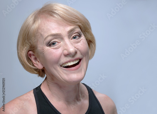 mature woman portrait close up smiling theeth 