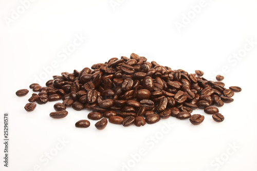 Several coffee beans on a white background