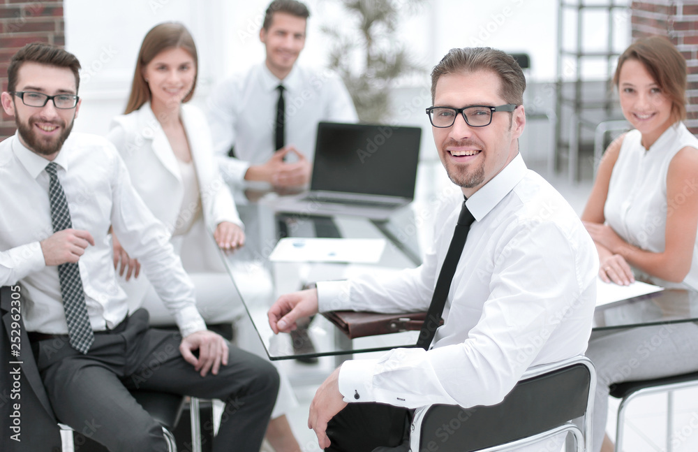 boss and business team sitting at their Desk