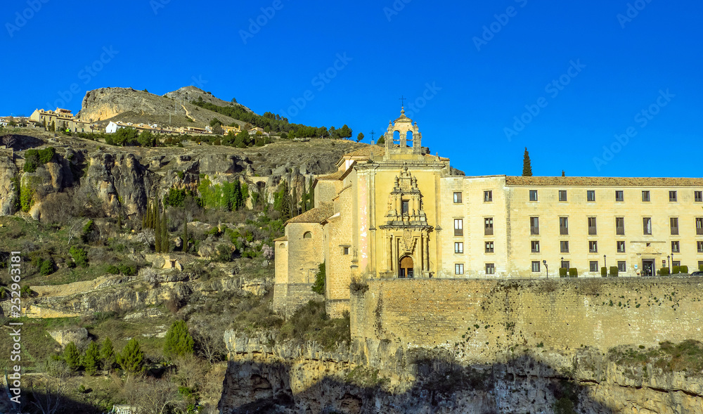 Panorama of the Uclés Monastery of the old town of Cuenca at night. Tour of tourism. Famous Hanging Houses.