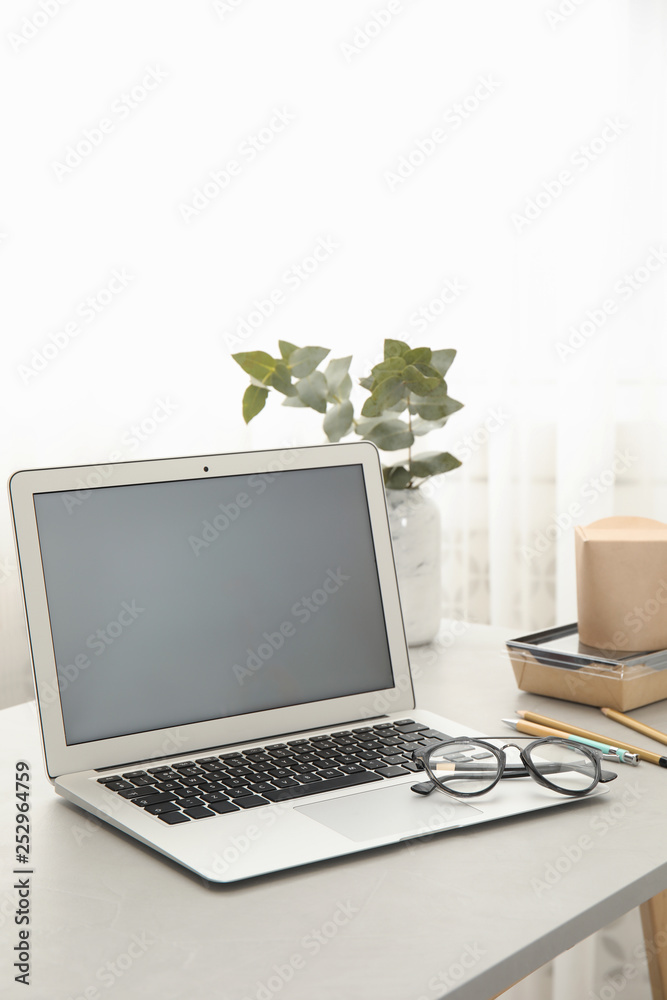 Cozy blogger workplace with laptop at home Cozy blogger workplace with laptop at home