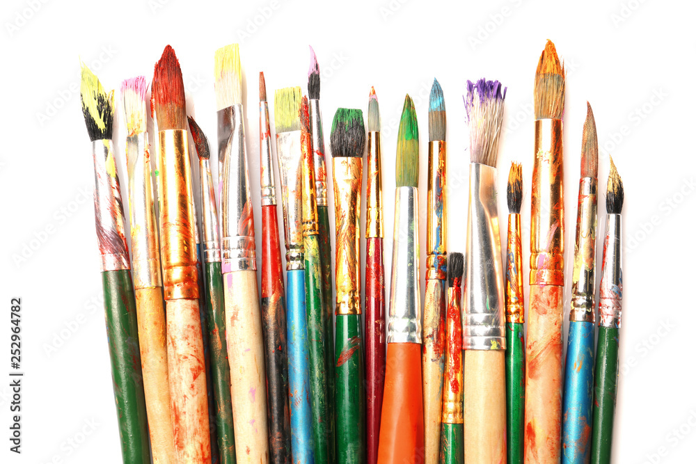Different paint brushes on white background, top view Different paint brushes on white background, top view