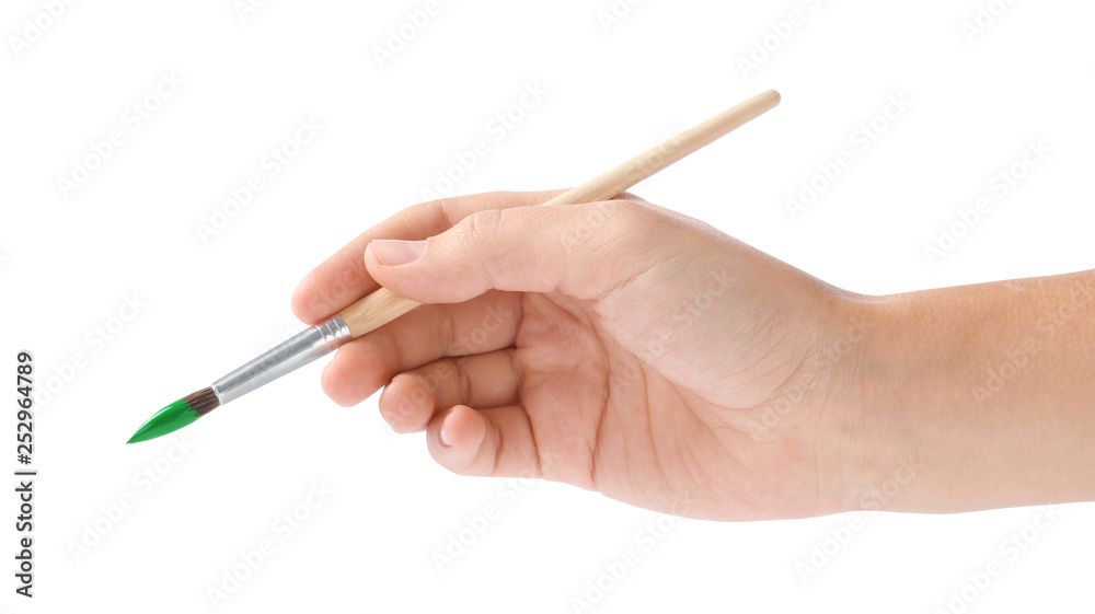 Young woman holding brush with color paint on white background, closeup Young woman holding brush with color paint on white background, closeup