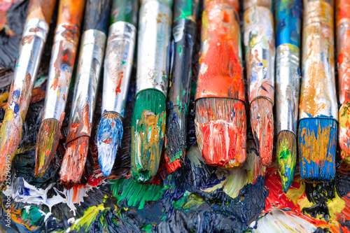 Paint brushes and paints for drawing.