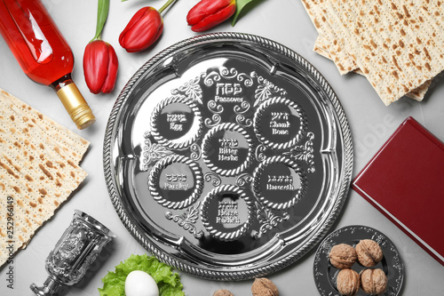 Flat lay composition with symbolic Passover (Pesach) items on color background photo