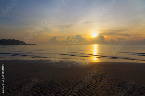 Sunrise in the sea on beach at Thung Wua Lan