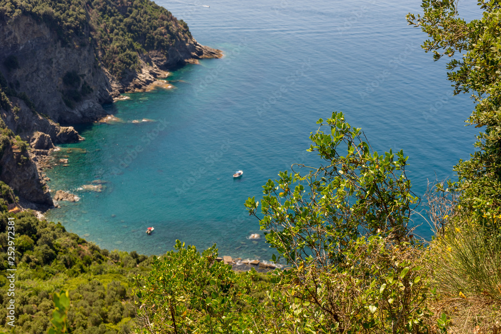 Italy, Cinque Terre, Corniglia, a large body of water surrounded by trees
