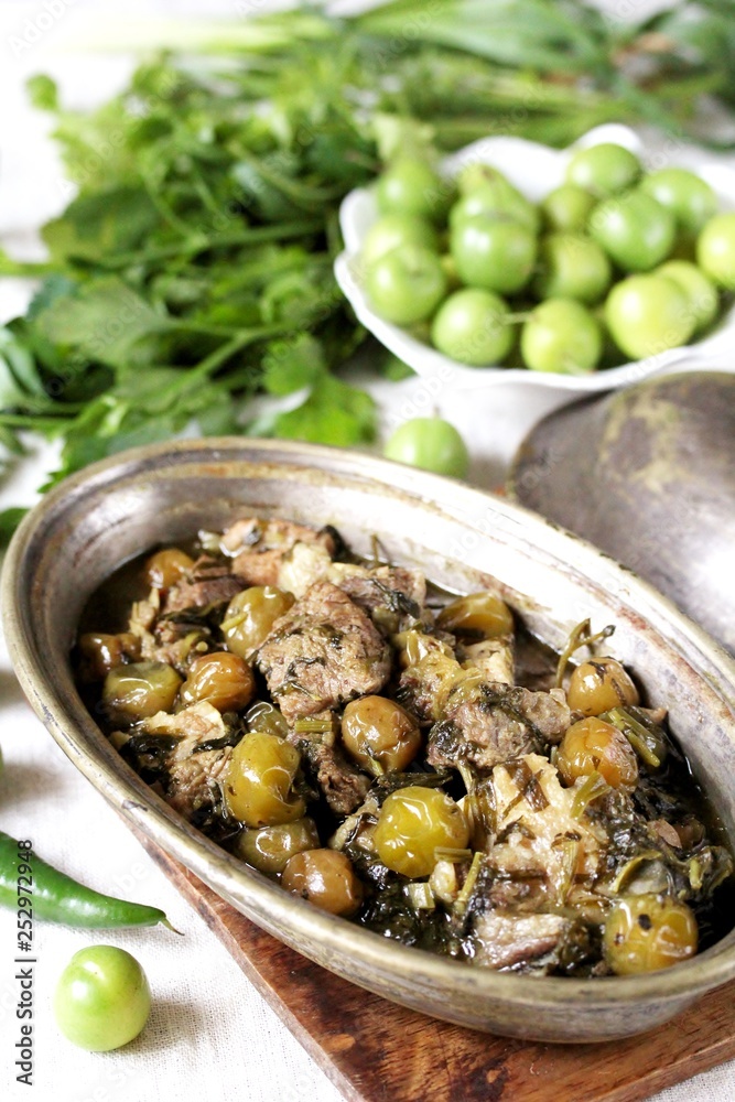 Alluciye- or the Turkish dish. Meat stew with green plum and greens. green plum recipe. Greengage stew. dishes from unripe plums. Keto diet dish Alluciye- or the Turkish dish. Meat stew with green plum and greens. green plum recipe. Greengage stew. dishes from unripe plums. Keto diet dish