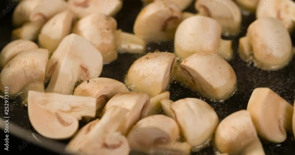 Champignons mushrooms roasting Cooking closeup Macro shot in Pan 4K video Champignons mushrooms roasting Cooking closeup Macro shot in Pan 4K video