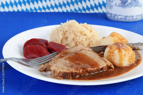 Sauerbraten or German Pot Roast with Potato Dumplings; sauerkraut and pickled beets photo