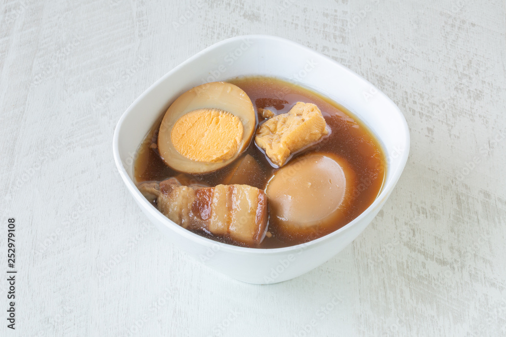 Egg and Pork in Sweet Brown Sauce on white background. Egg and Pork in Sweet Brown Sauce on white background.