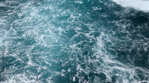 Churning ocean water and splashing waves.