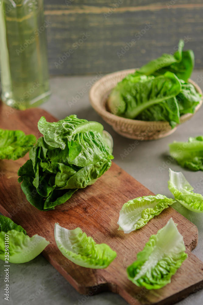 ripe organic green salad Romano on a cutting board ripe organic green salad Romano on a cutting board