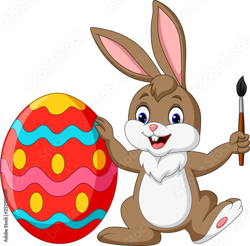 Cartoon rabbit painting an Easter egg