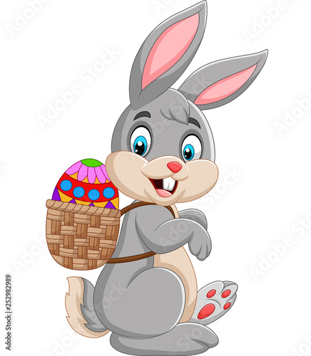 Easter Bunny carrying basket of Easter egg