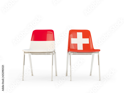 Two chairs with flags of Indonesia and switzerland