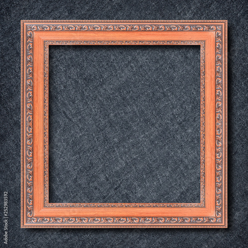 wooden frame on Dark grey black slate background or texture.