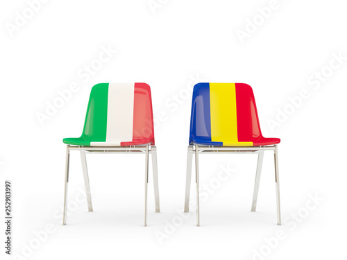 Two chairs with flags of Italy and romania