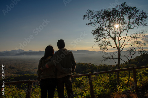 silhouette of a couple on sunrise background in the morning. copy space for text. happiness concept. as valentine s day concept
