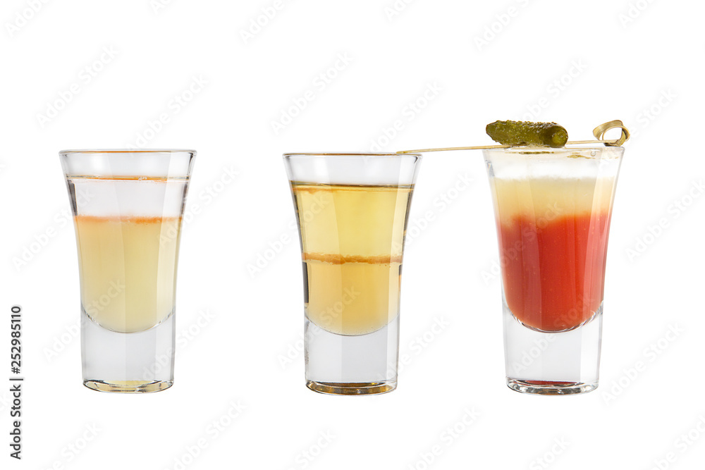 Set of alcohol shots on a white background. Three shots different with strong alcohol.