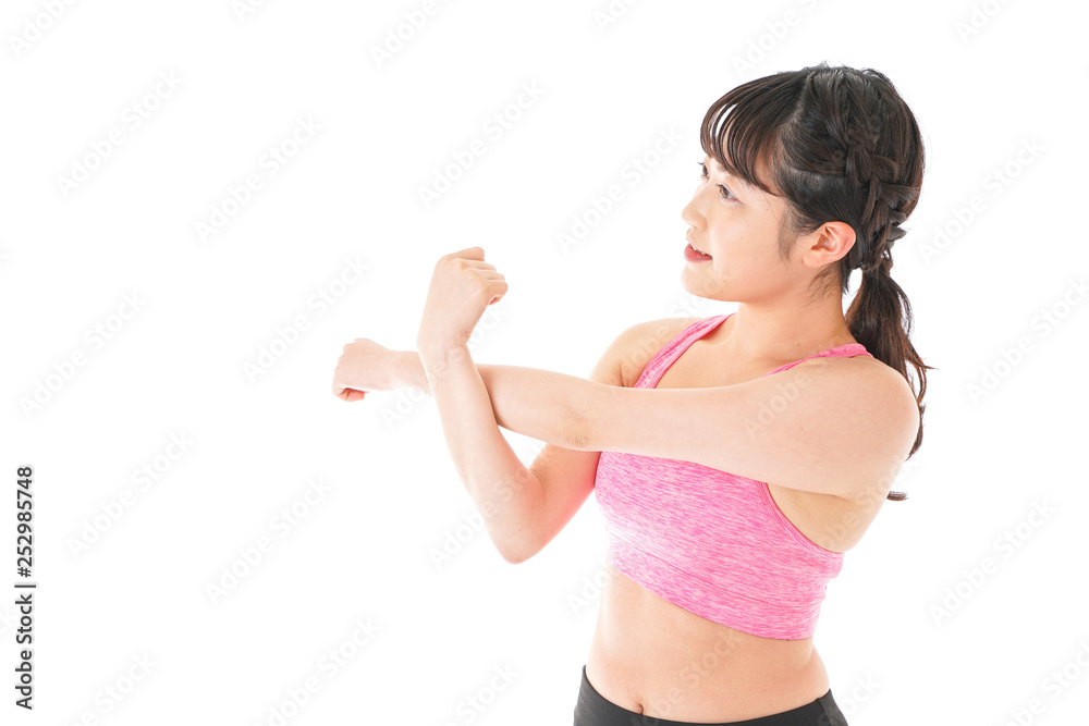 ウォーミングアップをする若い女性