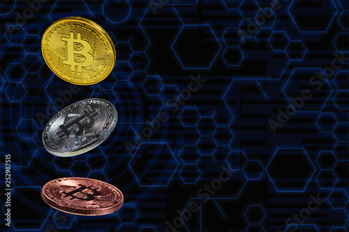 Bitcoin coins lavitate in mid air with blue circuit diagram as background photo