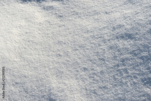White snow texture on a sunny day. Winter background © Talulla
