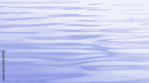 water surface with waves and ripples. tinted