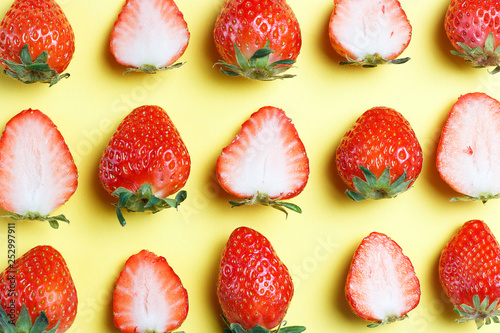 Pattern of strawberries isolated on yellow background, creative background