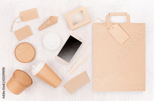 Set of cardboard package for different fast food for advertising, menu, banding identity - blank phone, bag, card, label, cup, box, packet on white wooden background.