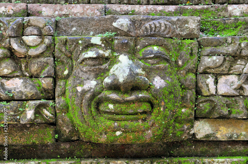 Carvings depicting demons, gods and Balinese mythological deities can be found throughout the Pura Dalem Agung Padangtegal temple in the Monkey Forest Sanctuary in Ubud, Bali, Indonesia. photo