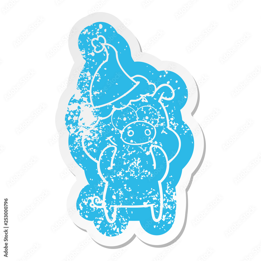 happy cartoon distressed sticker of a pig wearing santa hat