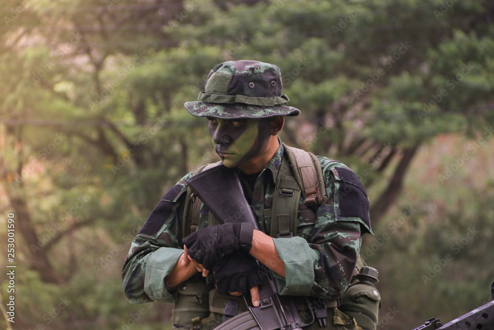 Standing military patrol in a wooded area, stand guard surveillance concept.
