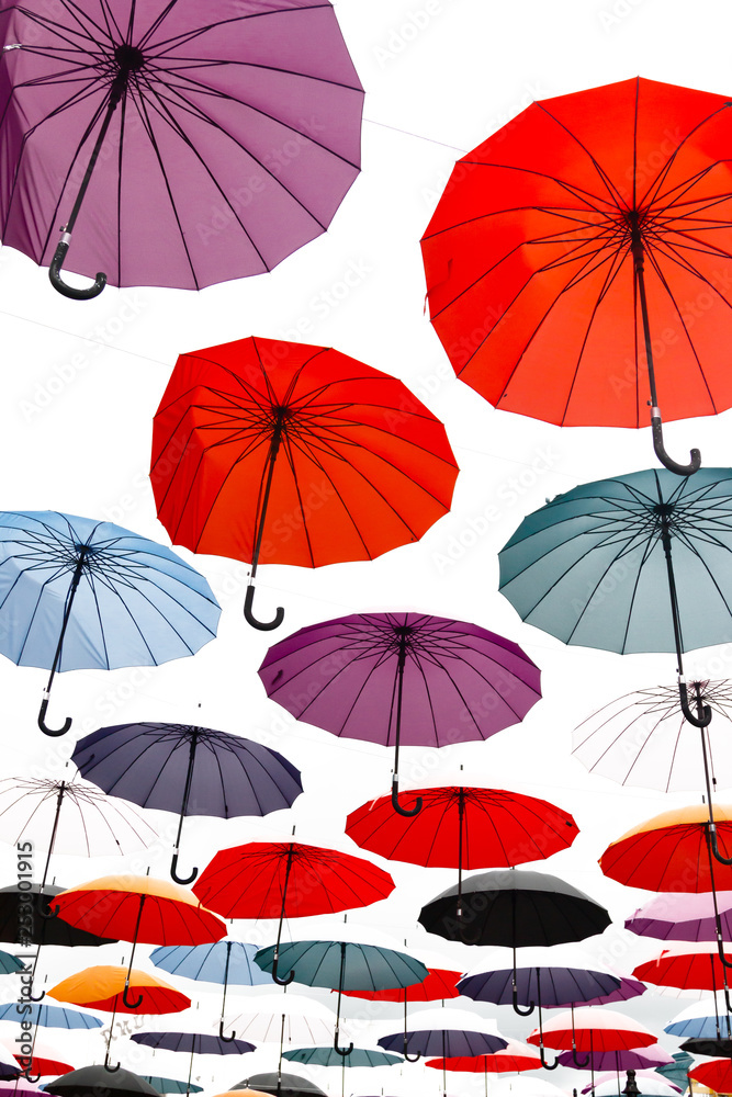 multi-colored umbrellas on a white background